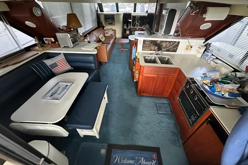 Slide: The Image of Interior of 1990 Blue Water 42 Coastal Cruiser with kitchen and seating area. - 38