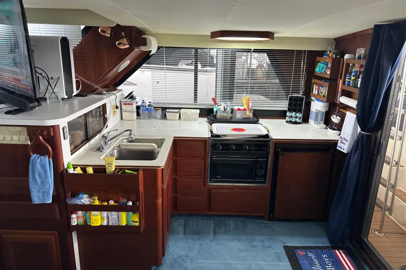 Slide: The Image of Interior of 1990 Blue Water 42 Coastal Cruiser kitchen with appliances and storage. - 41