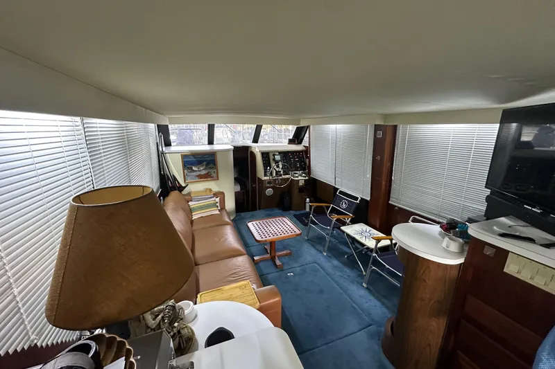 Slide: The Image of Interior of 1990 Blue Water 42 Coastal Cruiser with cozy seating and nautical decor. - 50