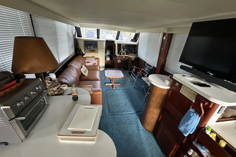 Slide: The Image of Interior of 1990 Blue Water 42 Coastal Cruiser with cozy seating and modern amenities. - 51