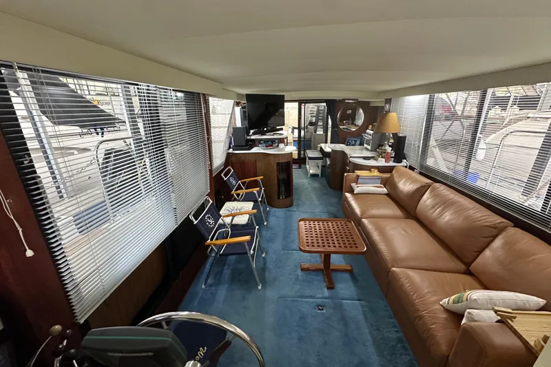 Slide: The Image of Interior of 1990 Blue Water 42 Coastal Cruiser with leather sofa and nautical decor. - 52