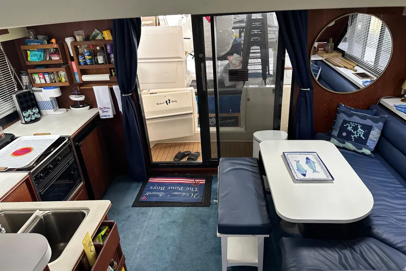 Slide: The Image of Interior of 1990 Blue Water 42 Coastal Cruiser with kitchen and seating area. - 54