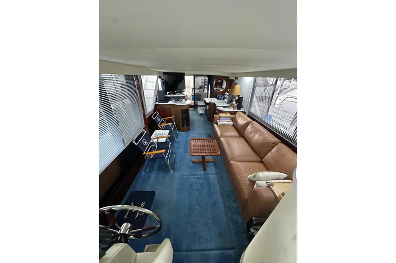 Slide: The Image of Interior of 1990 Blue Water 42 Coastal Cruiser with leather seating and nautical decor. - 55