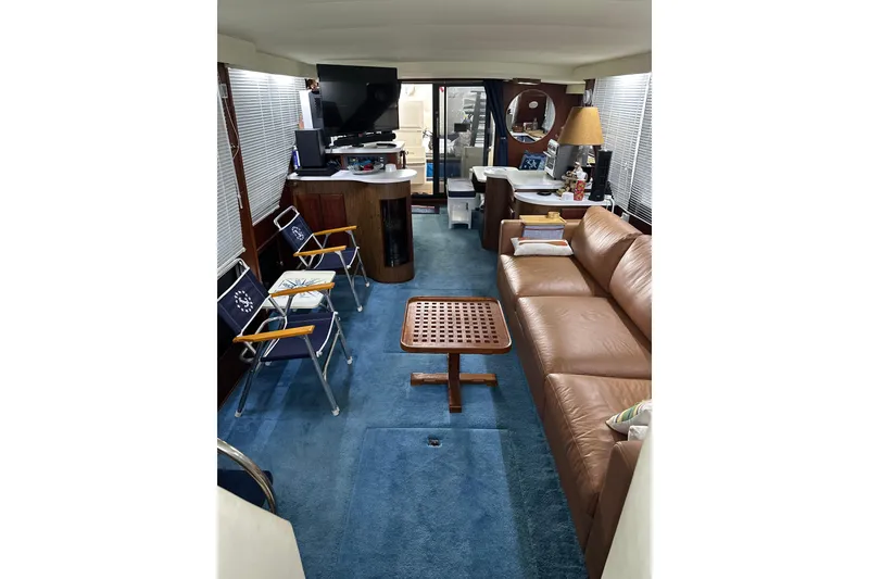 Slide: The Image of Interior of 1990 Blue Water 42 Coastal Cruiser with leather sofa and modern amenities. - 56