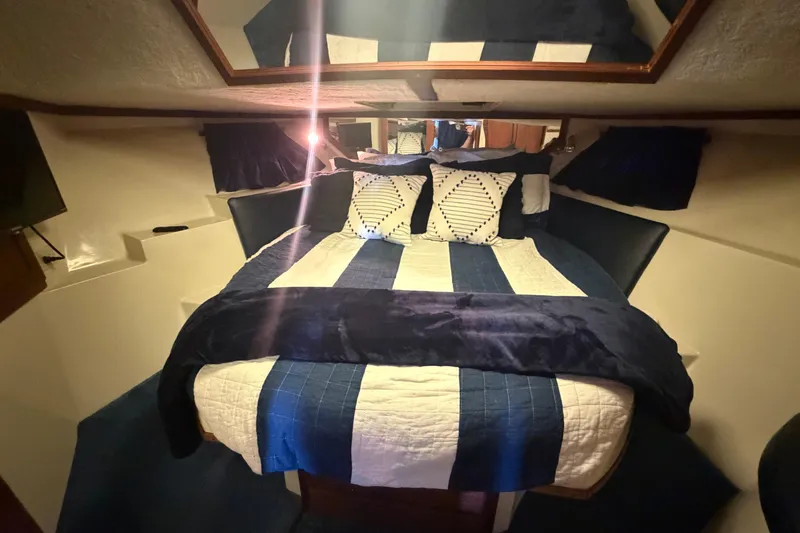 Slide: The Image of Cozy bedroom in 1990 Blue Water 42 Coastal Cruiser with nautical decor. - 57