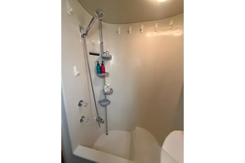 Slide: The Image of Shower area in 1990 Blue Water 42 Coastal Cruiser with wall-mounted storage shelves. - 61