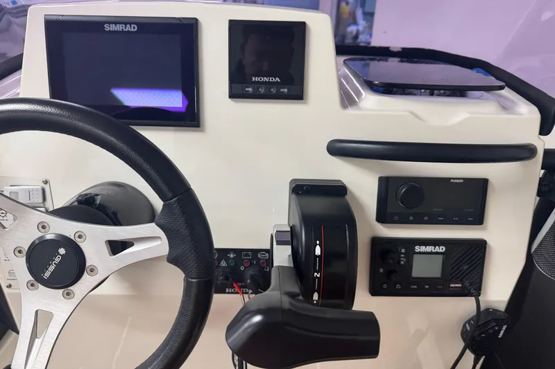 Slide: The Image of Control panel of 2020 Brig Eagle 6.7 boat with Simrad and Honda displays. - 10