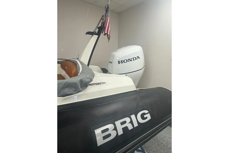 Slide: The Image of 2020 Brig Eagle 6.7 boat with Honda outboard motor in showroom. - 2