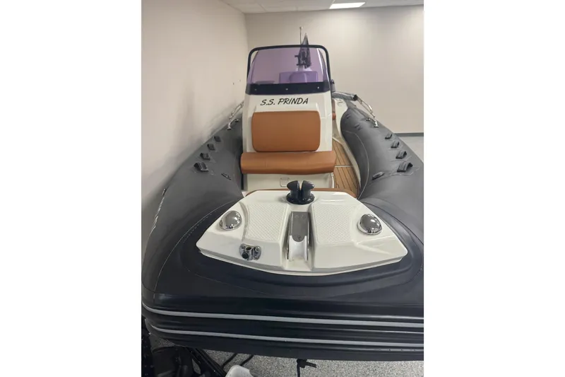 Slide: The Image of 2020 Brig Eagle 6.7 inflatable boat with brown seating, indoors. - 3