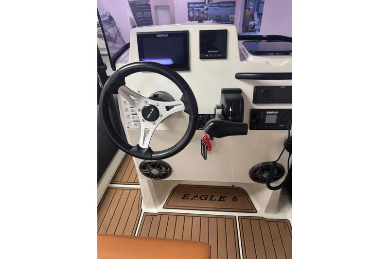 Slide: The Image of Cockpit of 2020 Brig Eagle 6.7 with steering wheel and control panel. - 9