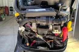 Slide: The Image of Engine components of a 2021 Boston Whaler 150 Montauk boat, detailed view. - 13