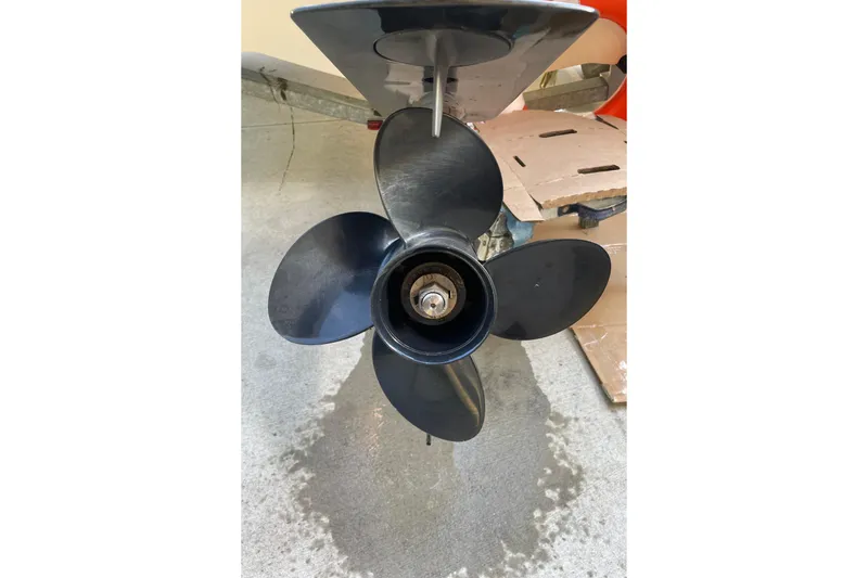 Slide: The Image of Propeller of a 2021 Boston Whaler 150 Montauk boat on concrete surface. - 9