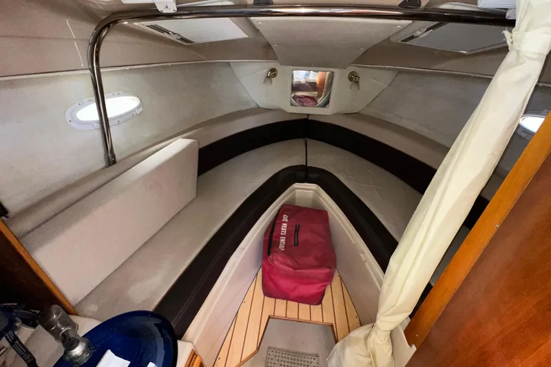 Slide: The Image of 2016 Cutwater C-24 Coupe cabin interior with seating and storage. - 13