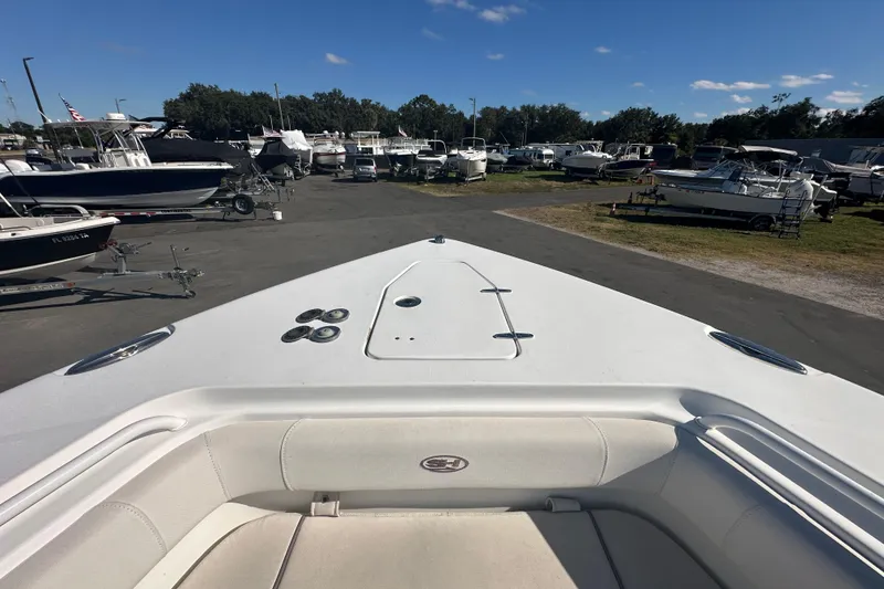 Slide: The Image of 2020 Sea Hunt Gamefish 27 boat with forward seating, displayed outdoors on a sunny day. - 81