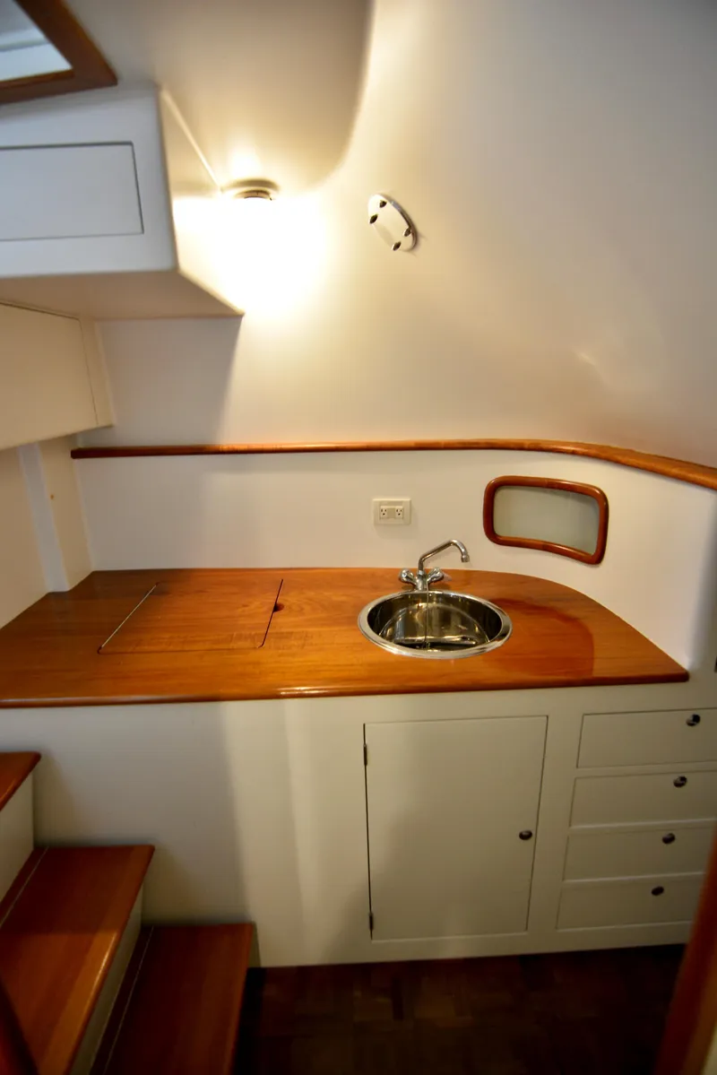 Slide: The Image of 2007 Gamefisherman 42 Walkaround helm with navigation display and open cabin door. - 15