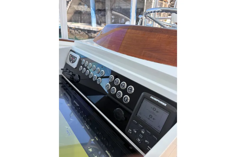 Slide: The Image of 2007 Gamefisherman 42 Walkaround boat with open storage compartment filled with canned drinks. - 22