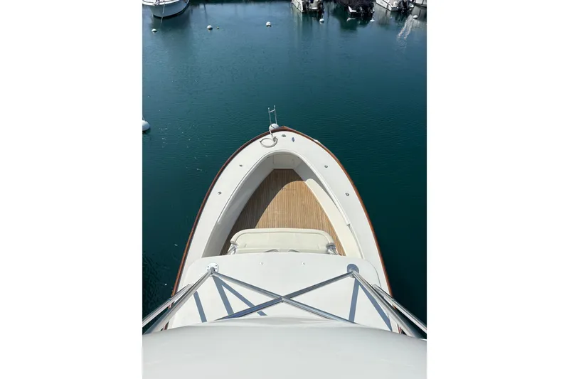 Slide: The Image of Open storage compartment on 2007 Gamefisherman 42 Walkaround boat with wooden deck. - 27