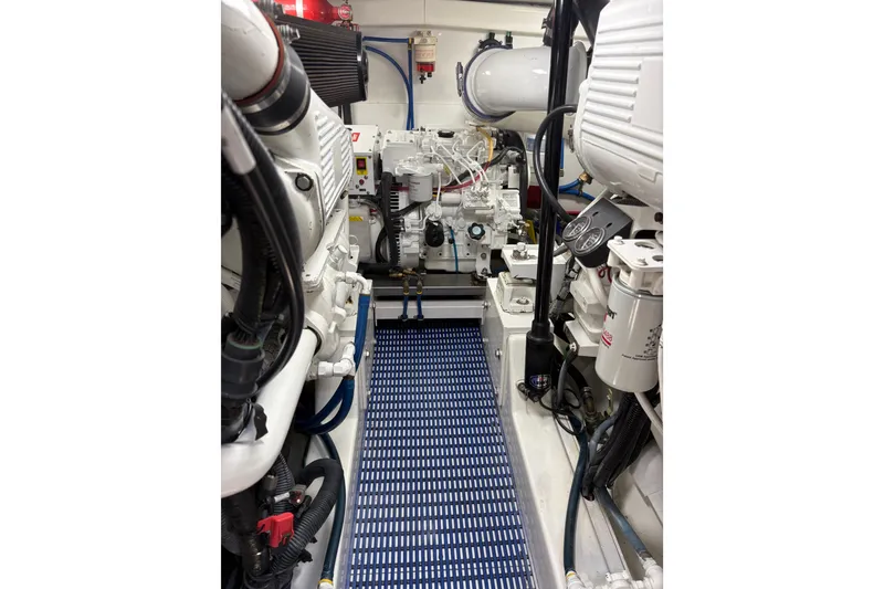 Slide: The Image of Control panel and gauge on 2007 Gamefisherman 42 Walkaround boat with blue flooring. - 39