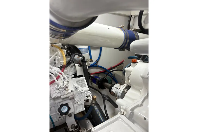 Slide: The Image of 2007 Gamefisherman 42 Walkaround engine compartment with open hatch and visible machinery. - 41