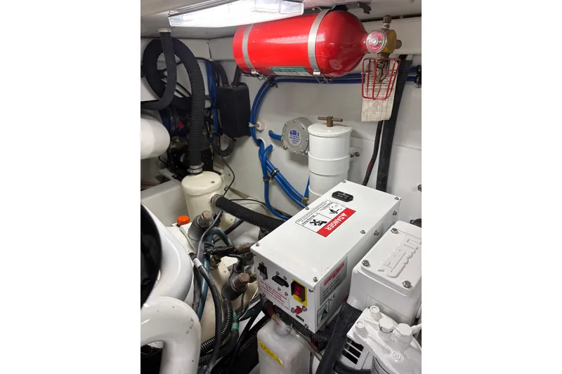 Slide: The Image of Engine compartment of 2007 Gamefisherman 42 Walkaround, showcasing detailed mechanical components. - 42