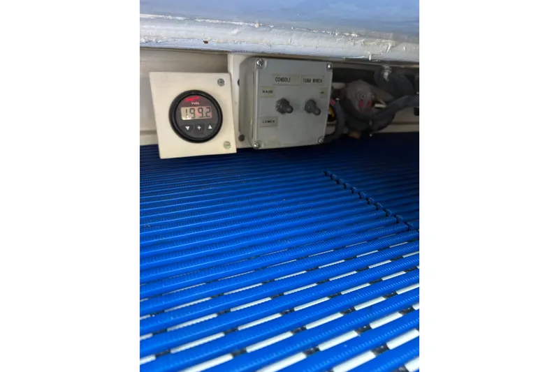 Slide: The Image of Engine compartment of 2007 Gamefisherman 42 Walkaround boat, showcasing detailed machinery. - 45