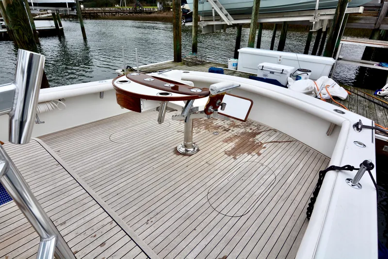 Slide: The Image of Fishing rods stored vertically in a 2007 Gamefisherman 42 Walkaround boat interior. - 5