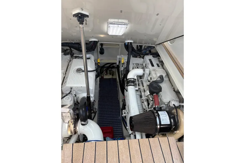 Slide: The Image of Engine compartment of 2007 Gamefisherman 42 Walkaround with visible hoses and components. - 50