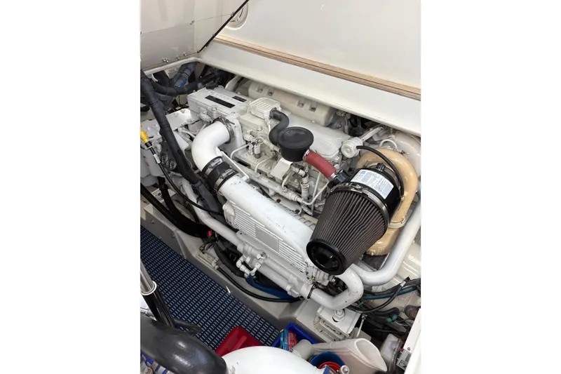 Slide: The Image of 2007 Gamefisherman 42 Walkaround boat interior with helm and seating area. - 51