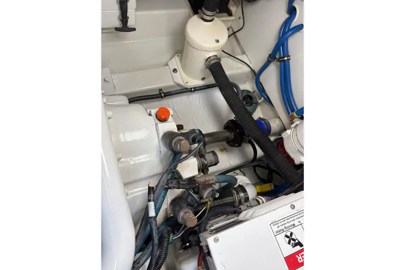 Slide: The Image of Storage compartment with water bottles on a 2007 Gamefisherman 42 Walkaround boat. - 56