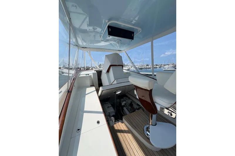 Slide: The Image of Interior view of 2007 Gamefisherman 42 Walkaround boat with wooden steps and storage compartments. - 58