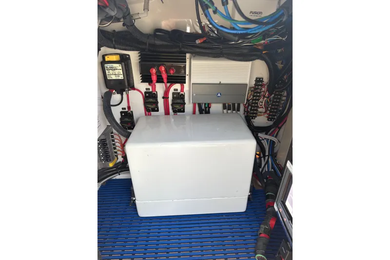 Slide: The Image of 2007 Gamefisherman 42 Walkaround boat docked in marina, featuring tall tower and spacious deck. - 59