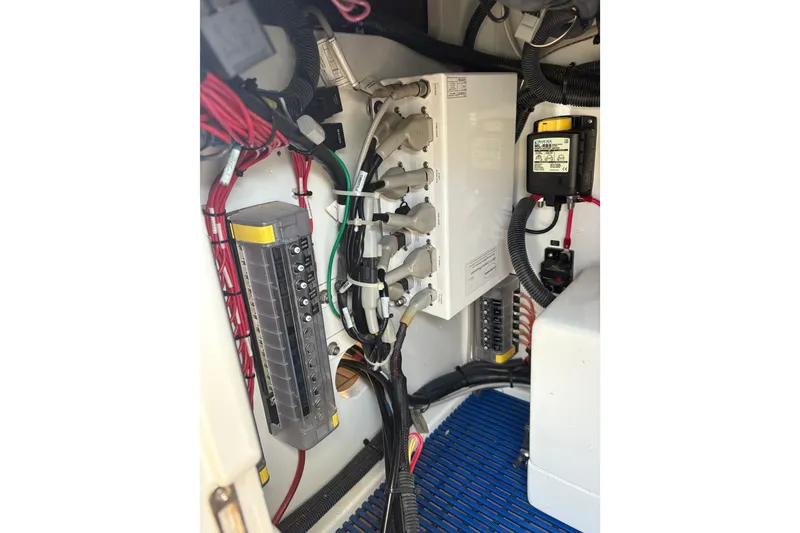 Slide: The Image of 2007 Gamefisherman 42 Walkaround boat docked in a marina, rear view. - 60