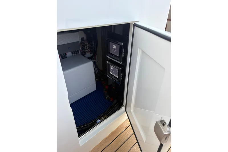 Slide: The Image of 2007 Gamefisherman 42 Walkaround boat docked, featuring a spacious deck and tall tower. - 61