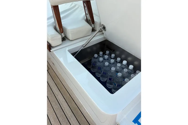 Slide: The Image of 2007 Gamefisherman 42 Walkaround boat deck with fishing chair and teak flooring. - 62