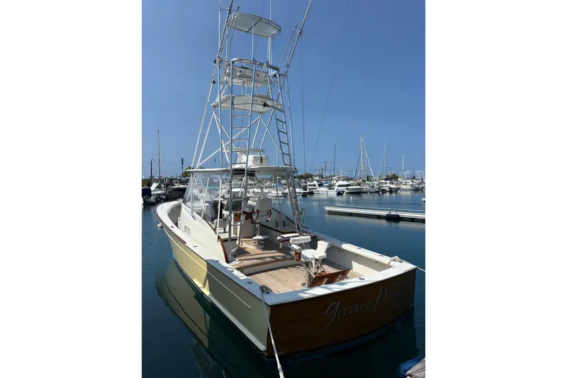 Slide: The Image of 2007 Gamefisherman 42 Walkaround boat with teak deck and cushioned seating. - 65