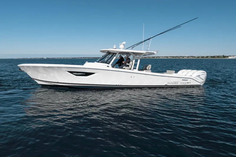Slide: The Image of 2023 Pursuit S 428 Sport boat on open water, side view, clear sky. - 11