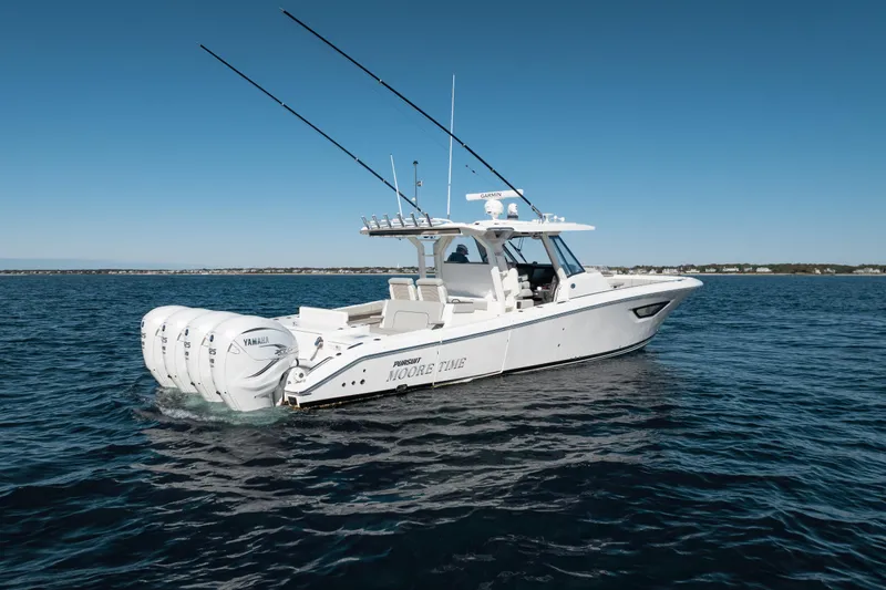 Slide: The Image of 2023 Pursuit S 428 Sport boat on open water, featuring multiple Yamaha engines. - 5