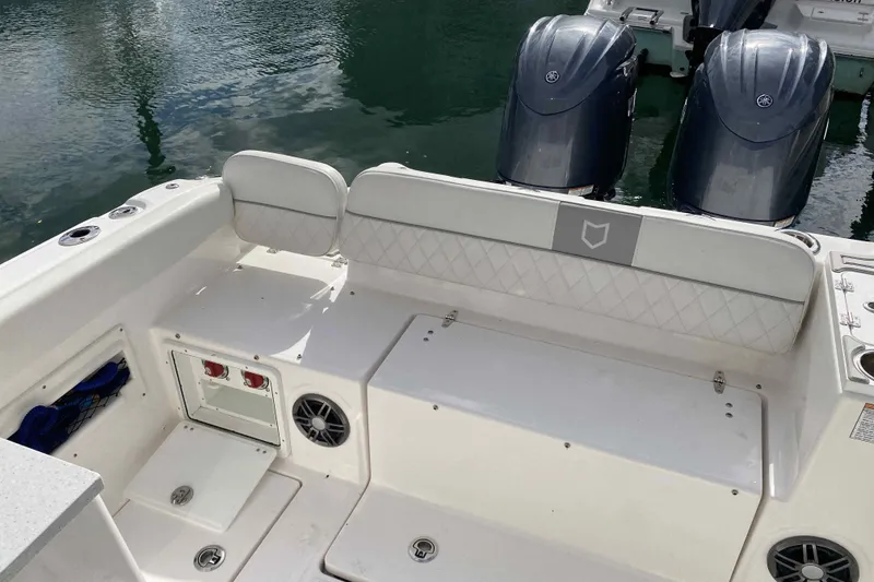 Slide: The Image of 2025 Sea Fox 268 Traveler boat interior with dual engines and seating area. - 10