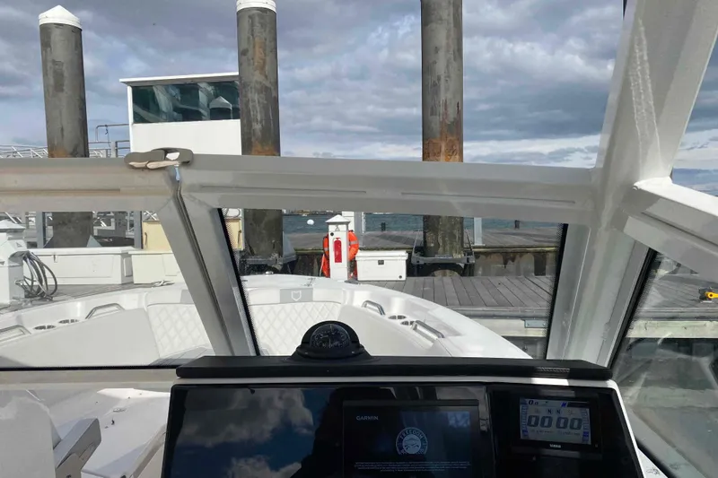 Slide: The Image of Interior view of 2025 Sea Fox 268 Traveler boat at dock, showcasing dashboard and seating. - 6