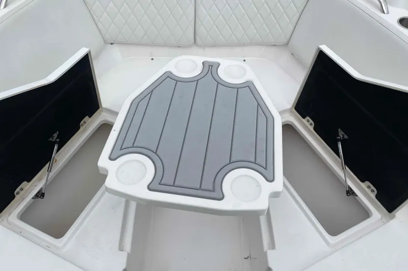 Slide: The Image of 2025 Sea Fox 268 Traveler boat interior with storage compartments and table. - 8