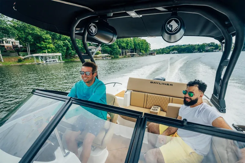 Slide: The Image of Manufacturer Provided Image: Two people enjoying a ride on a 2025 Bayliner D20 boat. - 3