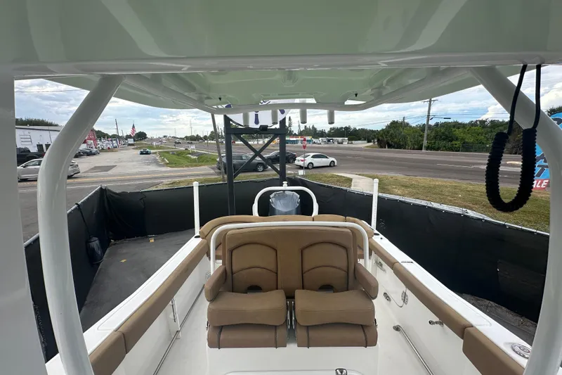 Slide: The Image of 2020 Sea Hunt Ultra 255 SE boat dashboard with steering wheel and controls. - 106