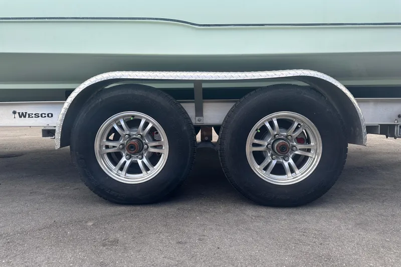 Slide: The Image of Trailer wheels of a 2020 Sea Hunt Ultra 255 SE boat on Wesco trailer. - 11