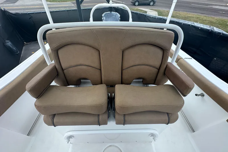 Slide: The Image of 2020 Sea Hunt Ultra 255 SE boat with "AFY's Tampa" sign, cloudy sky background. - 119