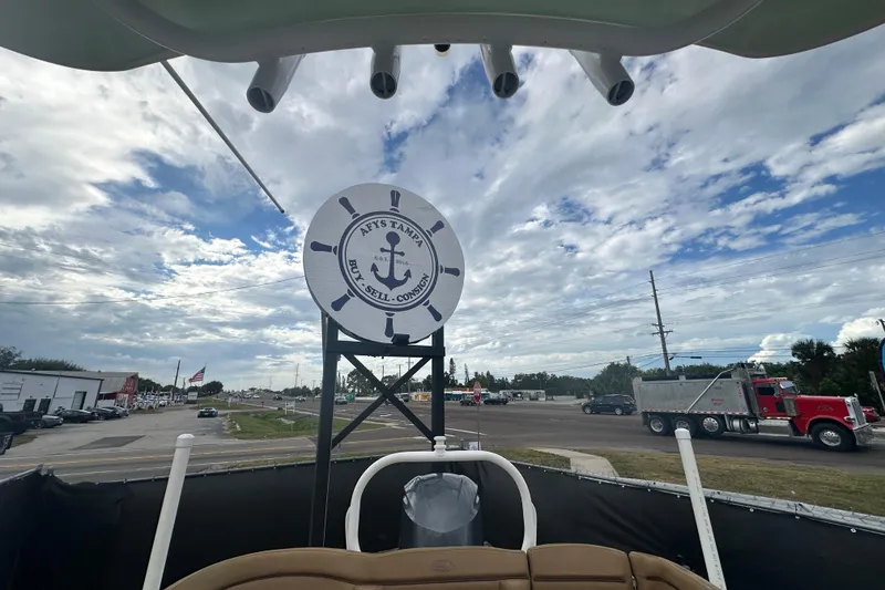 Slide: The Image of 2020 Sea Hunt Ultra 255 SE boat interior with tan seating and white deck. - 121