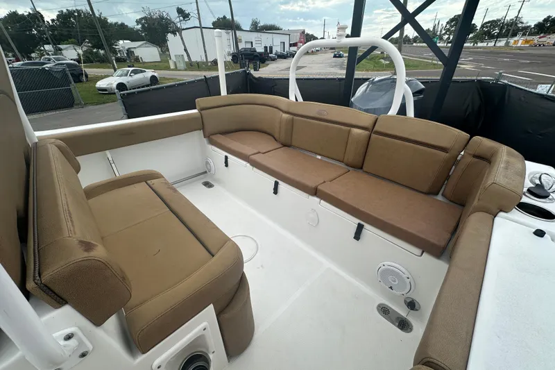 Slide: The Image of 2020 Sea Hunt Ultra 255 SE boat with tan seating and Yamaha 300 engine. - 125
