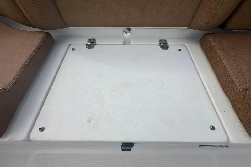 Slide: The Image of Bilge area of 2020 Sea Hunt Ultra 255 SE boat, showing pumps and hoses. - 133