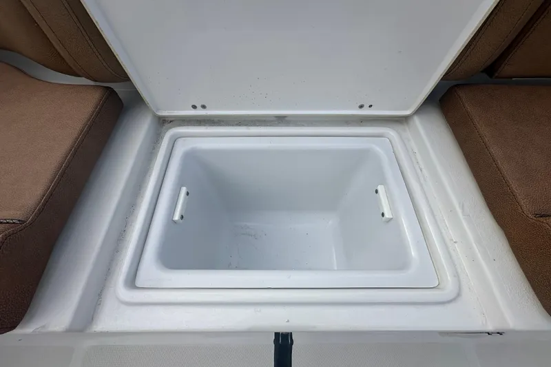 Slide: The Image of Brown cushioned seating on 2020 Sea Hunt Ultra 255 SE boat interior. - 134