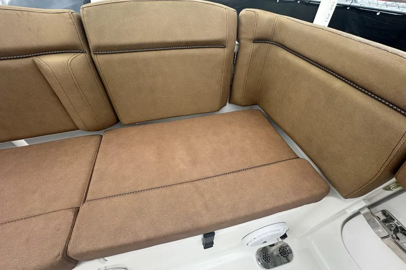 Slide: The Image of Storage compartment with bucket on 2020 Sea Hunt Ultra 255 SE boat. - 136