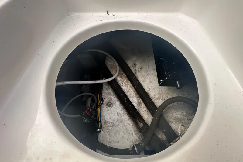 Slide: The Image of 2020 Sea Hunt Ultra 255 SE boat interior with cushioned seating and logo detail. - 139